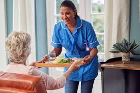 Caregiver assisting with meal